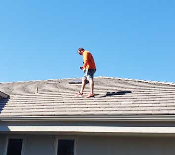 San-Diego-roof-inspection-showing-roof-inspector-on-the-roof